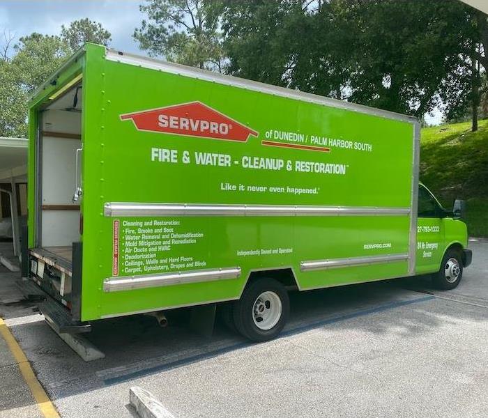 Green SERVPRO vehicle at a job site ready for action.