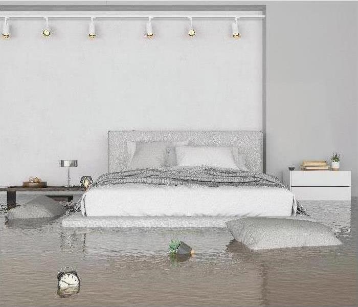 Bedroom with furniture floating in flood water
