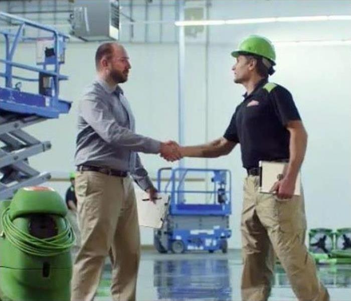SERVPRO Employee Shaking Hands with Business Owner